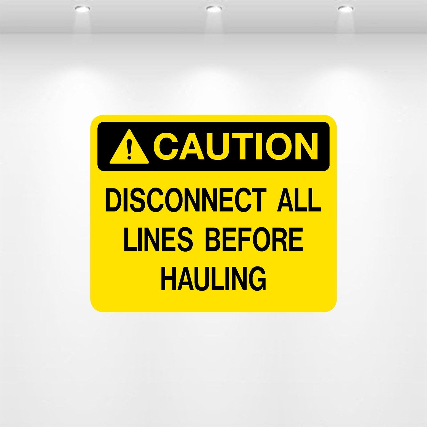 Caution: Disconnect All Lines Before Servicing decal — safety label for hydraulic and pressurized equipment